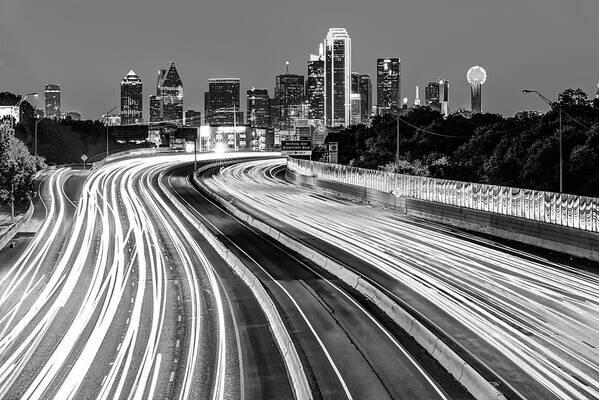 dallas texas monochrome skyline at dawn traffic rushes towards the city