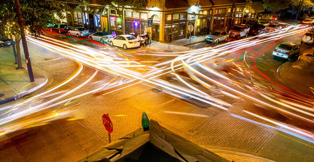 bishop arts district at night time lapsed photography shows the movement of traffic and shows the vibrancy of the neighborhood